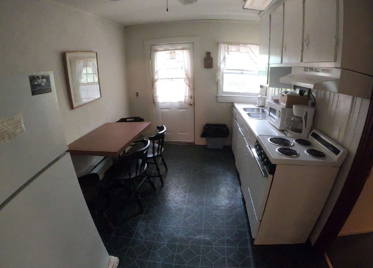 Efficiency dining nook beside the exterior door