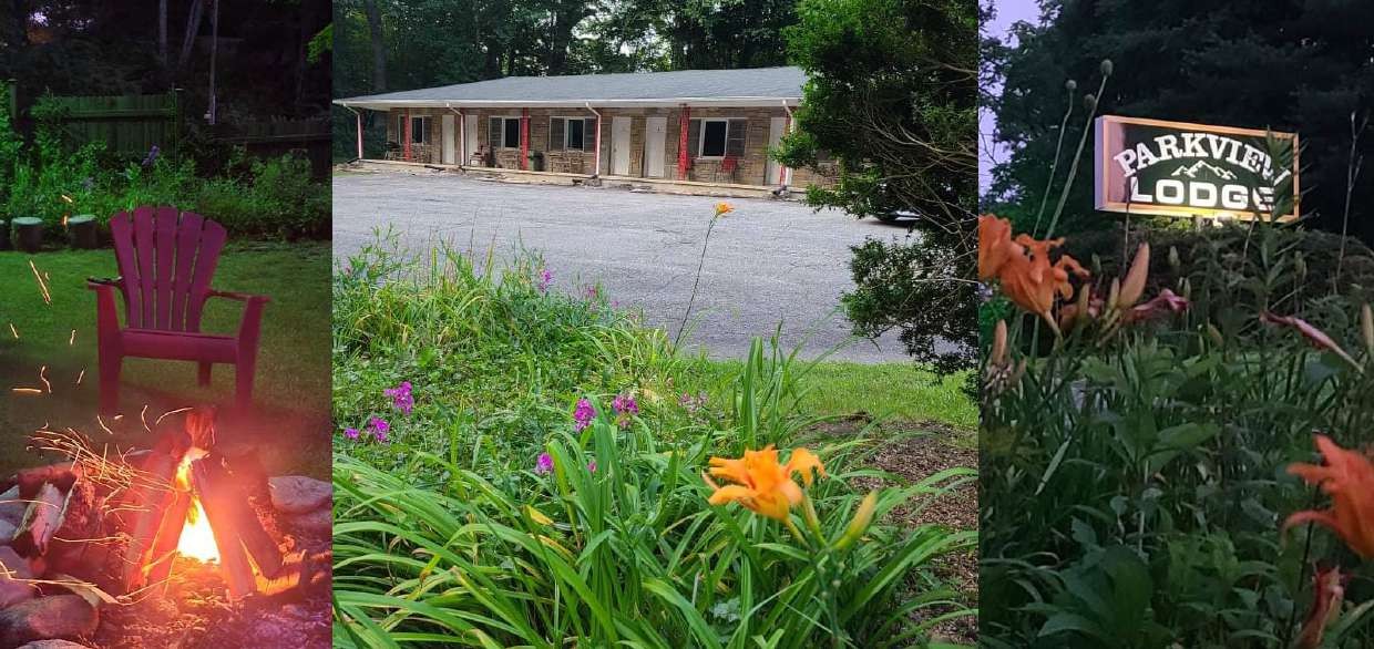 Fire pit and flowers with the lodge sign behind