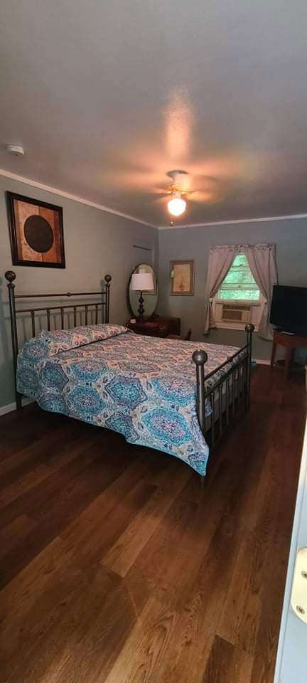 Quilted bed with dresser and mirror
