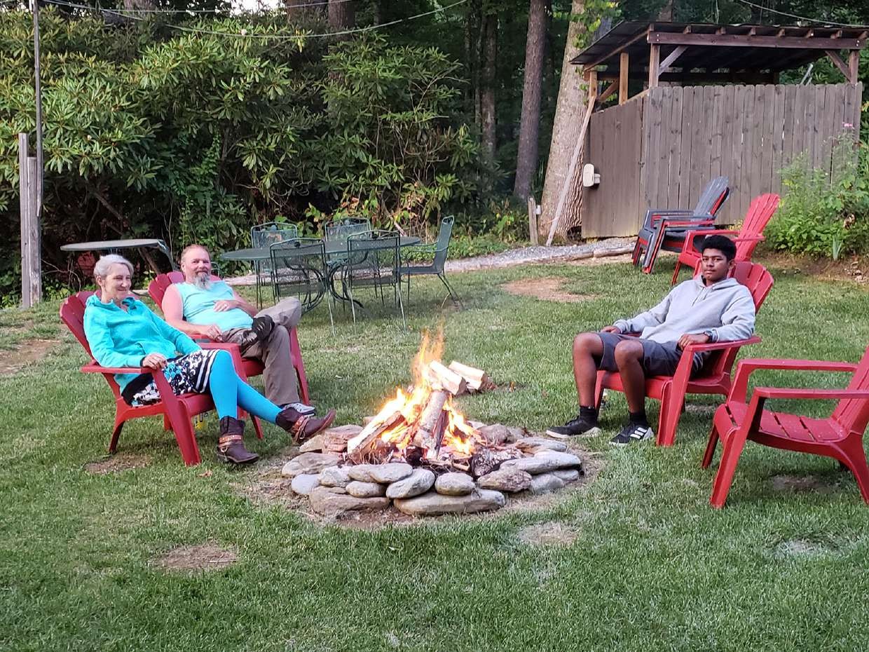 Guests gathered around the evening fire pit