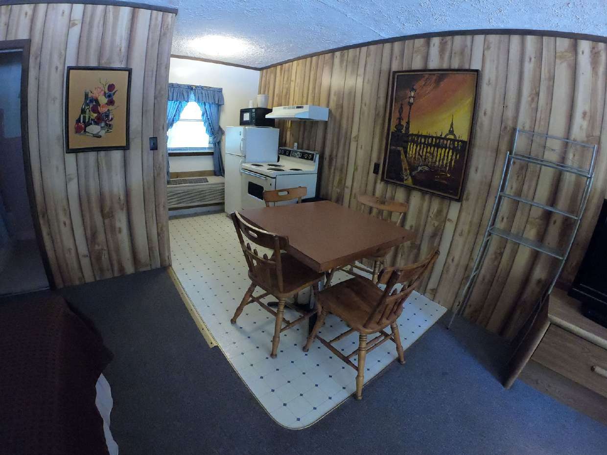 Efficiency kitchen with dining table and stove